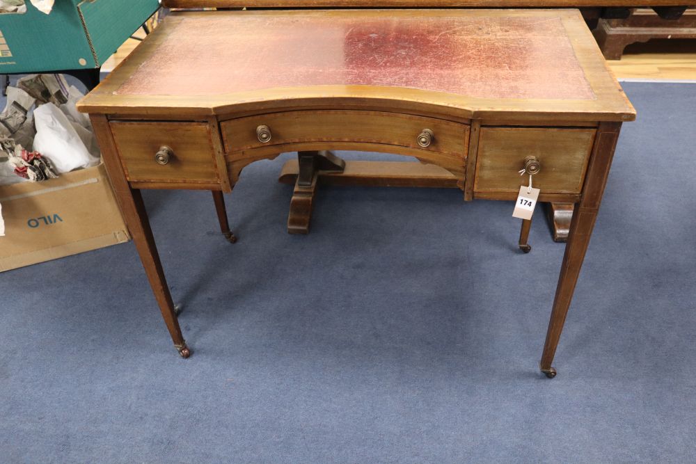 An Edwardian satinwood banded mahogany writing table, the concave front 98cm